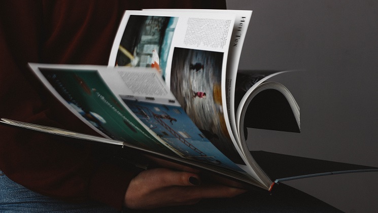 person listing through a catalogue